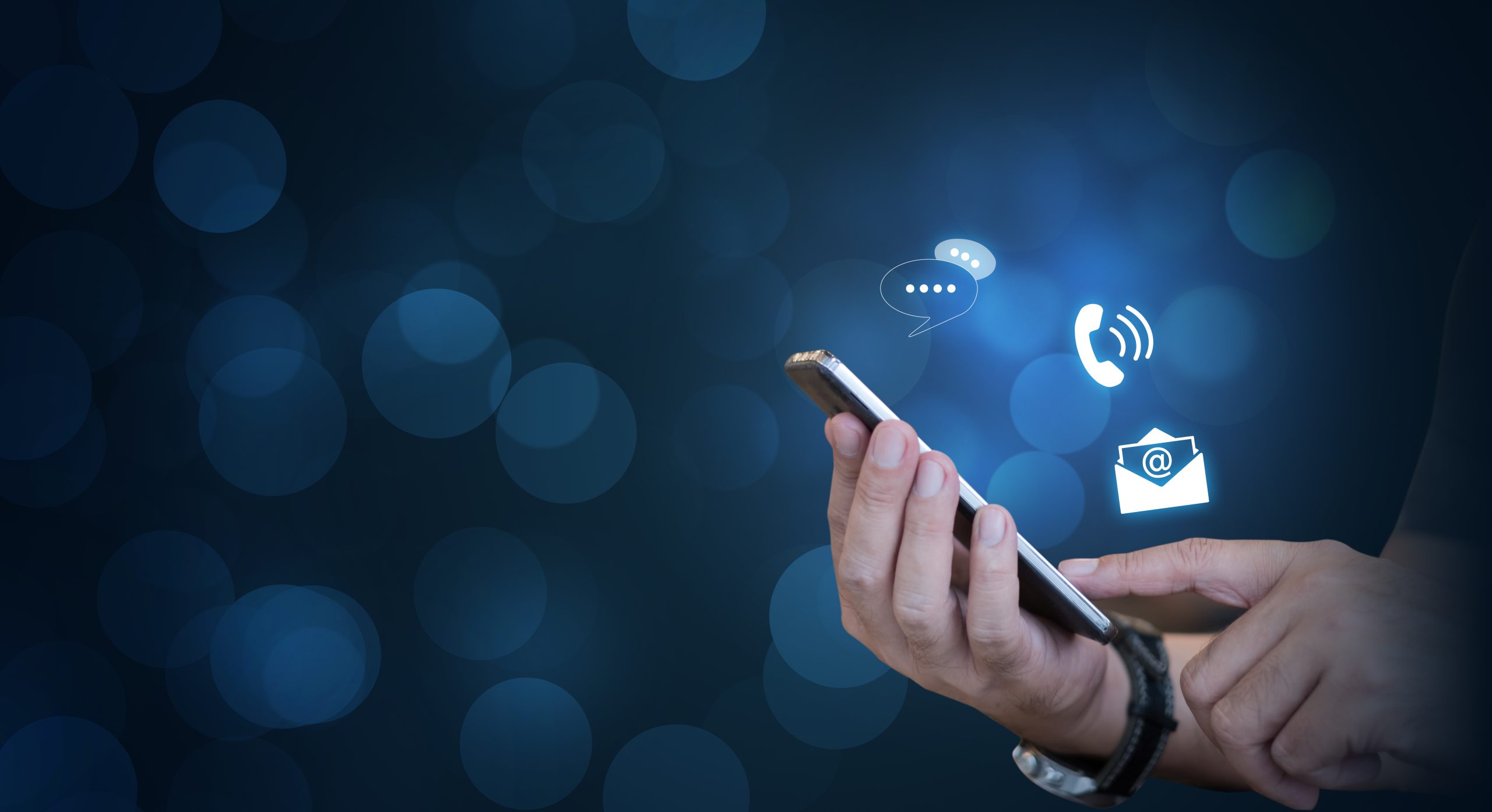 Contact,Us,,Hand,Of,A,Businessman,Holding,A,Mobile,Smartphone